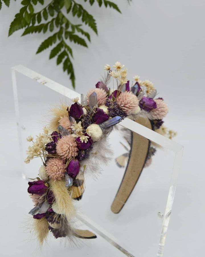 Pink and deep purple floral headband with crystals by @moonwakemeadow featuring textured dried blooms and soft grasses. Fresh accessory design.