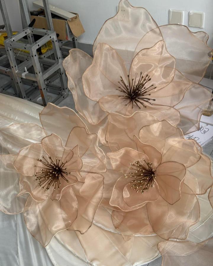 Sheer beige organza flower petals with delicate wire edges and stamens by @vanessa.floraldecor.china creating a soft, glowing floral craft.
