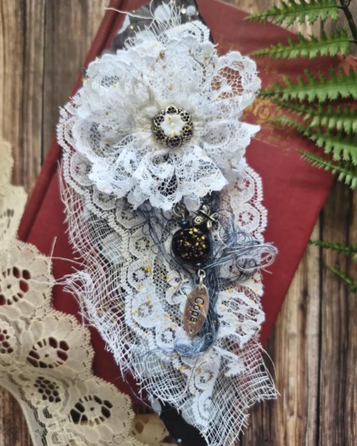 White lace fabric flower ideas from @irishrosecreations featuring vintage charms and delicate gold accents on rustic wood background.