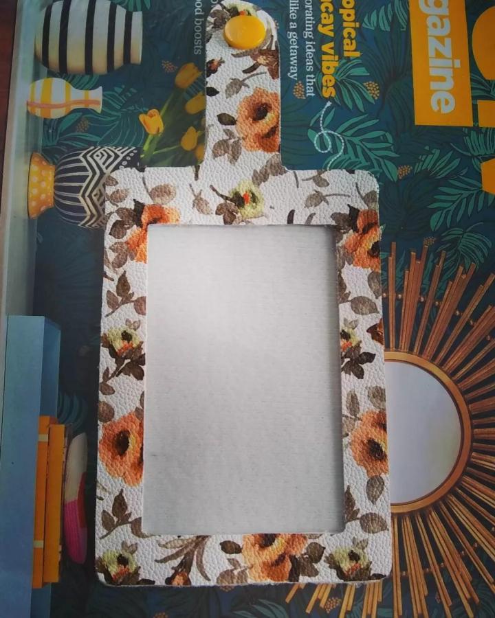 Floral patterned faux leather ID badge holder by @lsmith8318 featuring warm orange and brown tones in faux leather crafts.
