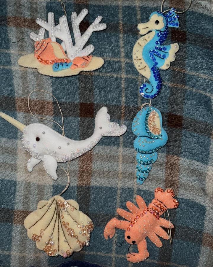 Creamy and pastel sea creature felt crafts from @coffeestitcher with pearl and sequin details showcasing felt crafts for adults.