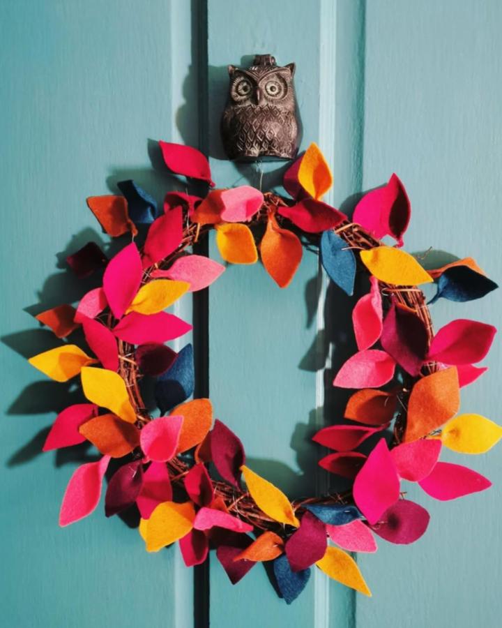Brightly Colored Felt Leaf Wreath From @haggytea Featuring Seasonal Handmade Decor With Warm Autumnal Tones