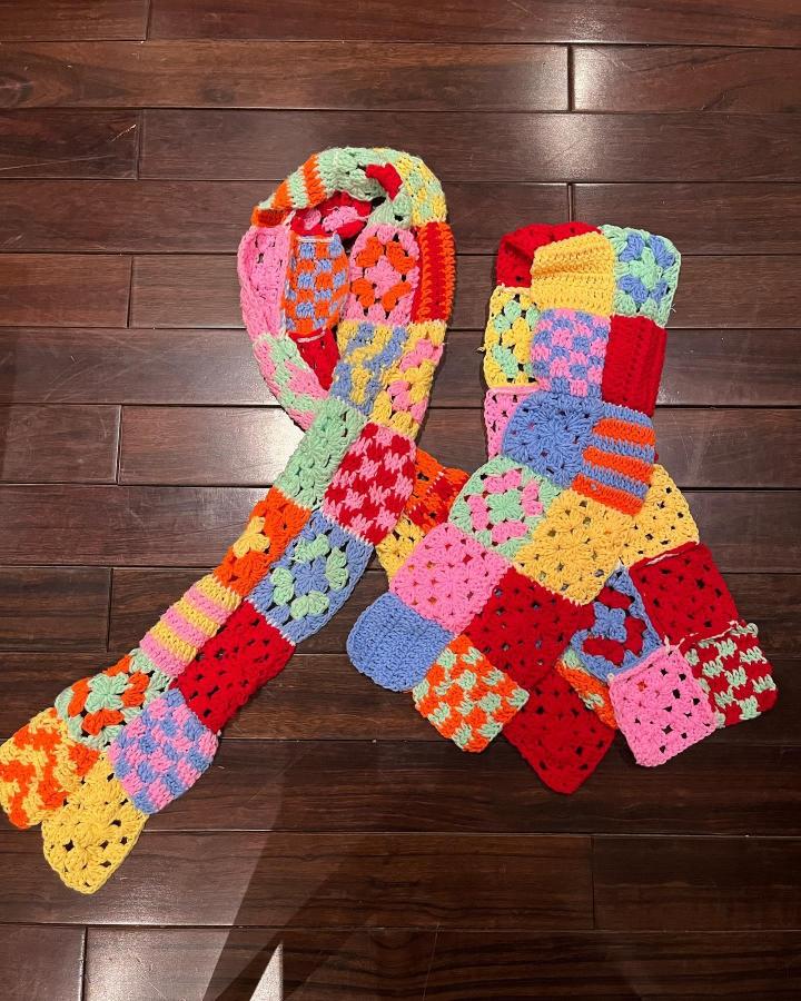 Colorful patchwork crochet scarf with bold bright squares by @getweavey showing creative yarn crafting and unique crochet techniques.