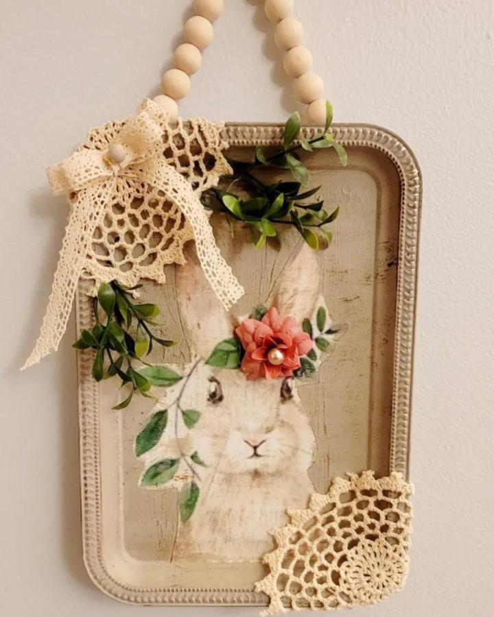 Cream lace vintage Easter wall hanging craft from @craftingwithnee. Rustic bunny design with wooden beads and floral accents for lace crafts for adults.