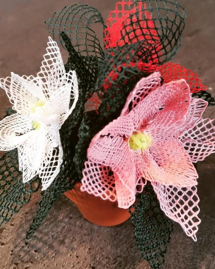Pink white and black mesh lace flowers with yellow centers handmade floral ornament by @creatieveomaelly delicate and textured craft detail