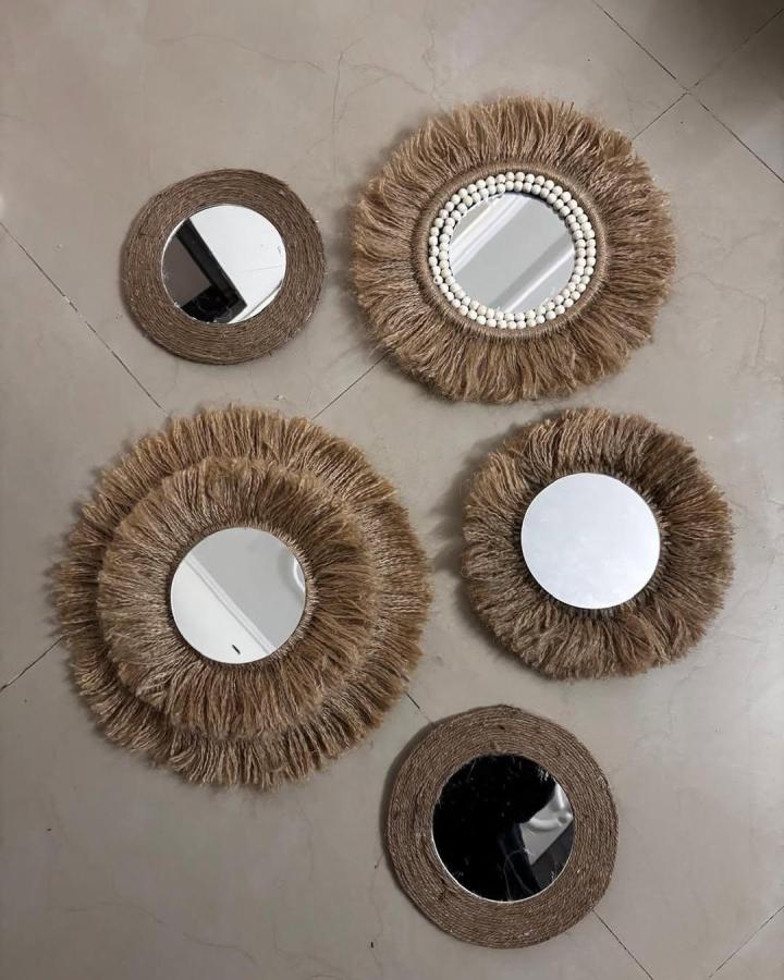 Jute and bead embellished round wall mirrors by @thoughtful_makers with rustic, bohemian woven designs.