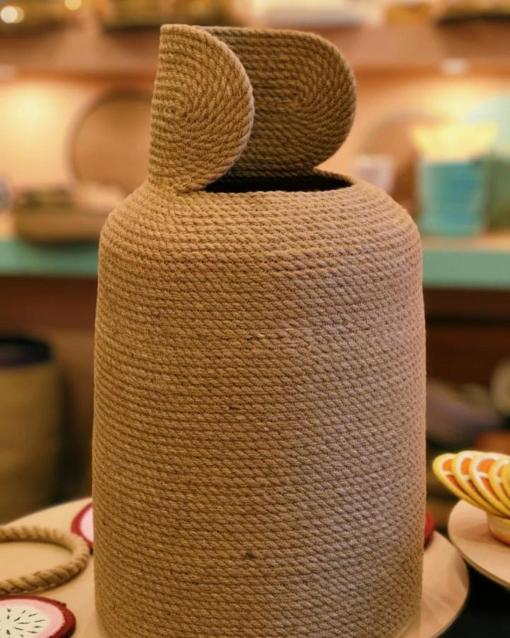 Natural jute rope kitchen canister cover by @luxury_rope_handmade showcasing a rustic and cozy handcrafted texture.