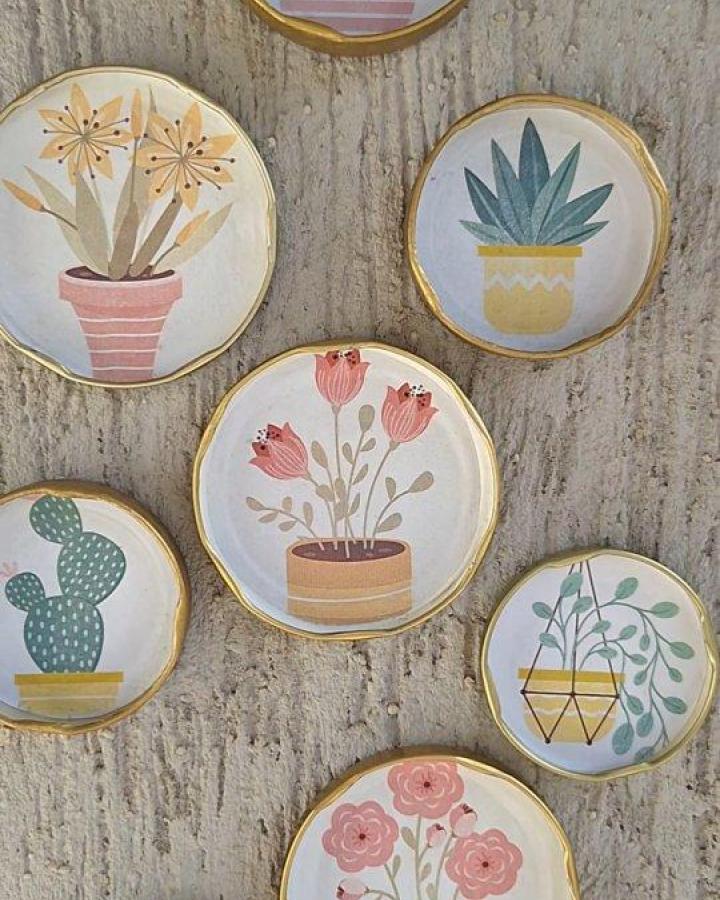 Pastel hand-painted clay pot coasters with gold edges from @diycrafts_crafty featuring floral and cactus designs perfect for summer décor.
