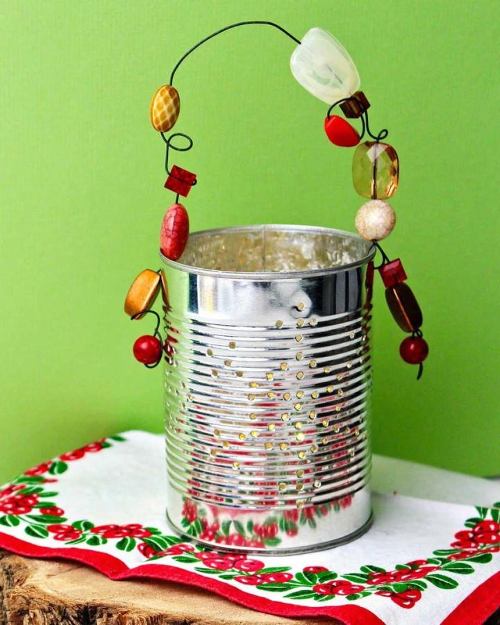 Beaded wire handle tin can lantern from @welcometonanas with colorful accents and punctured light holes. Bright and charming craft.