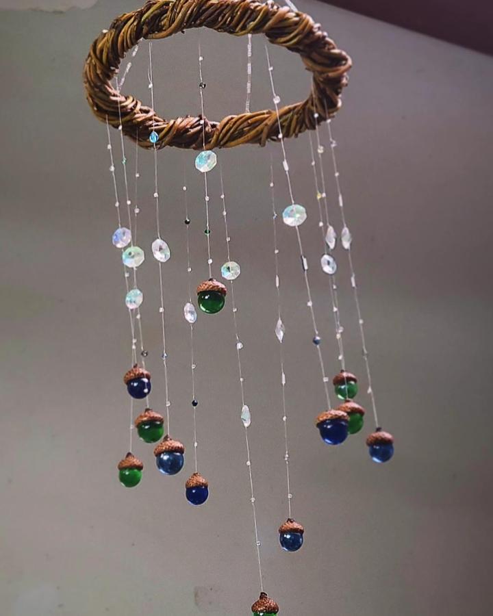 Glass marble acorn suncatcher with vine ring and sparkling beads by @adelynnsmagicaltreasures Hanging decorative mobile brightens indoor space.