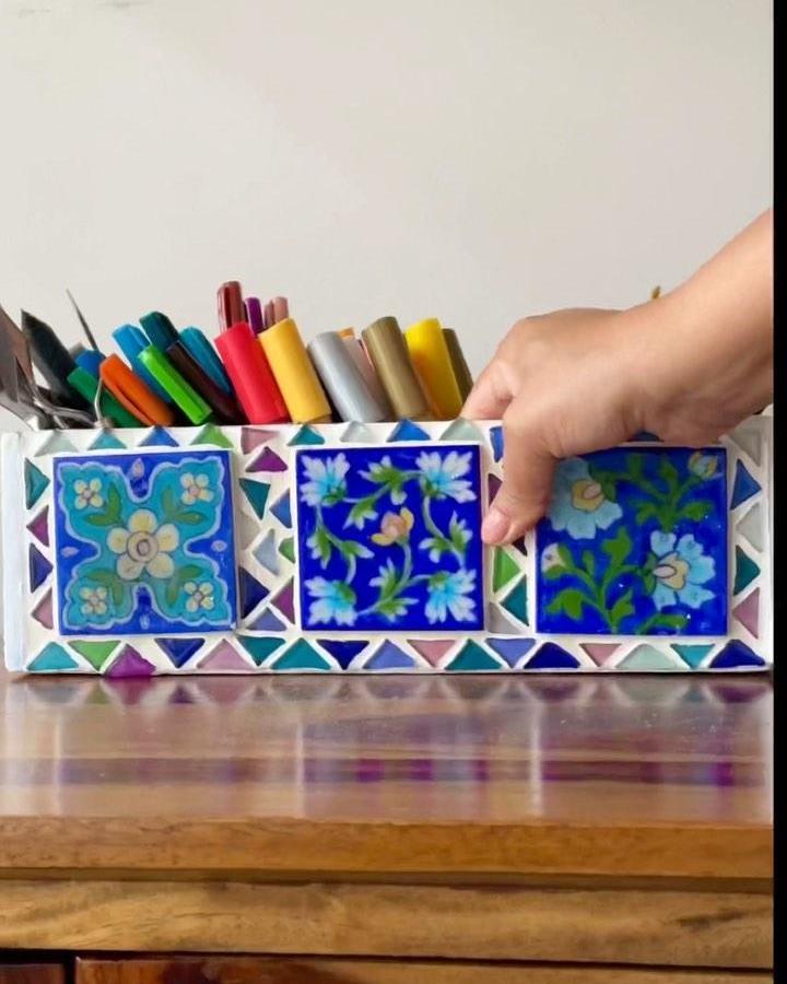 Vibrant blue floral ceramic tile crafts supply box from @the_kalpa_tree with colorful mosaic edging and craft pens inside.