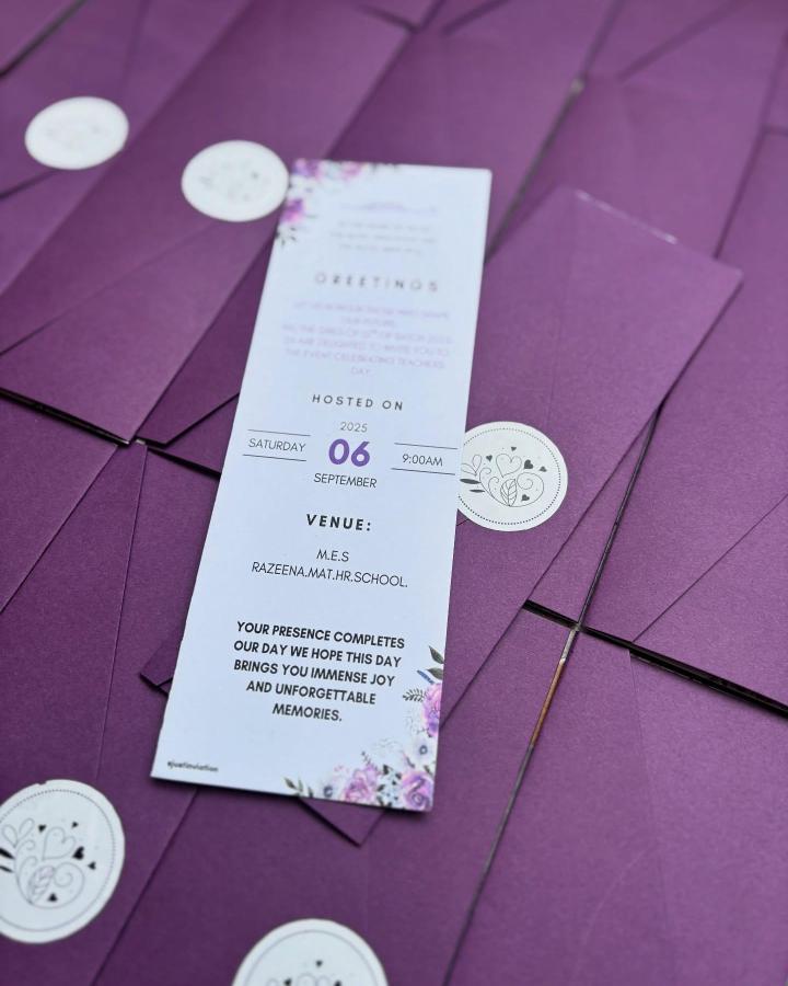 Purple envelopes with floral bookmark wedding invites from @justinvitation featuring elegant, handmade seal and clear modern typography.