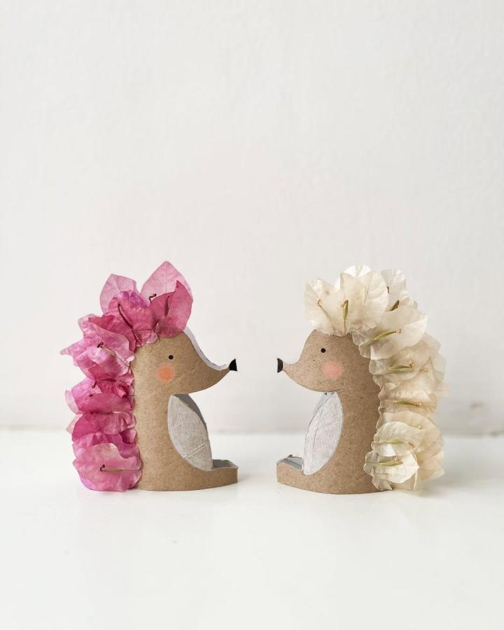 Pink and white bougainvillea petal hedgehog crafts made from tissue paper rolls by @margaretamiranti featuring delicate floral textures and rustic charm.