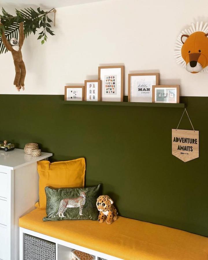 Mustard cushion and olive green seating nook with jungle print pillow and plush toy by @ourhaconbyhome. Stylish and playful storage bench redesign.