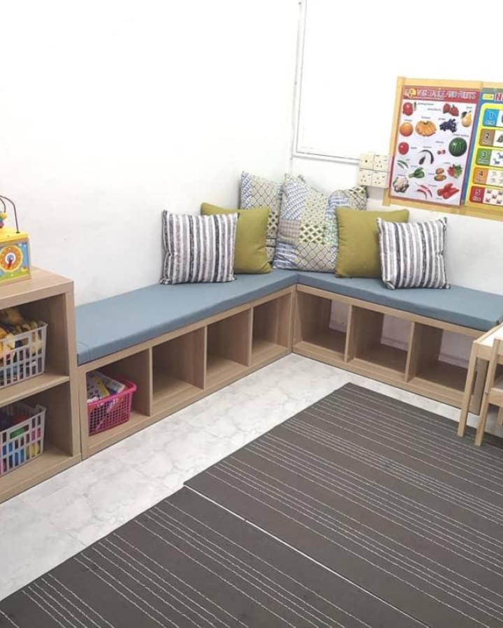 Light wood and blue cushioned seating corner bench from @angahfhira with practical cubby storage and decorative pillows.