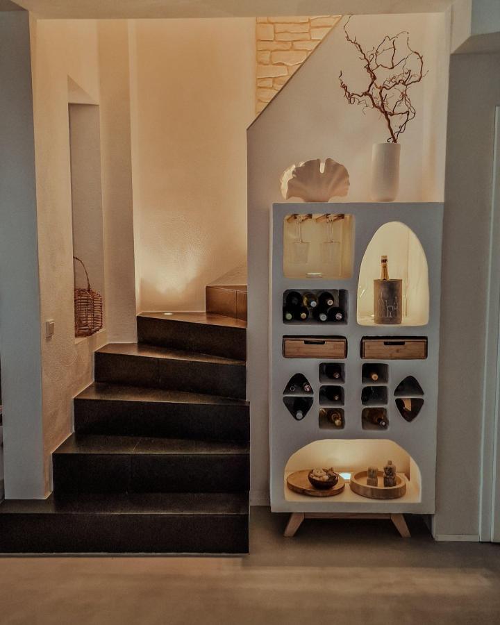 Creamy white multi-purpose storage unit with curved cutouts, wood drawers, and soft lighting by @insight.bohogarden showcasing custom shelving modification.