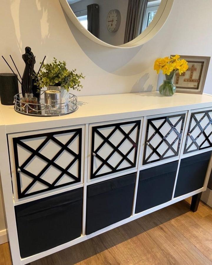Black and white lattice door Ikea Kallax hacks storage unit from @_thejosephcompany with modern stylish design and functional bins.
