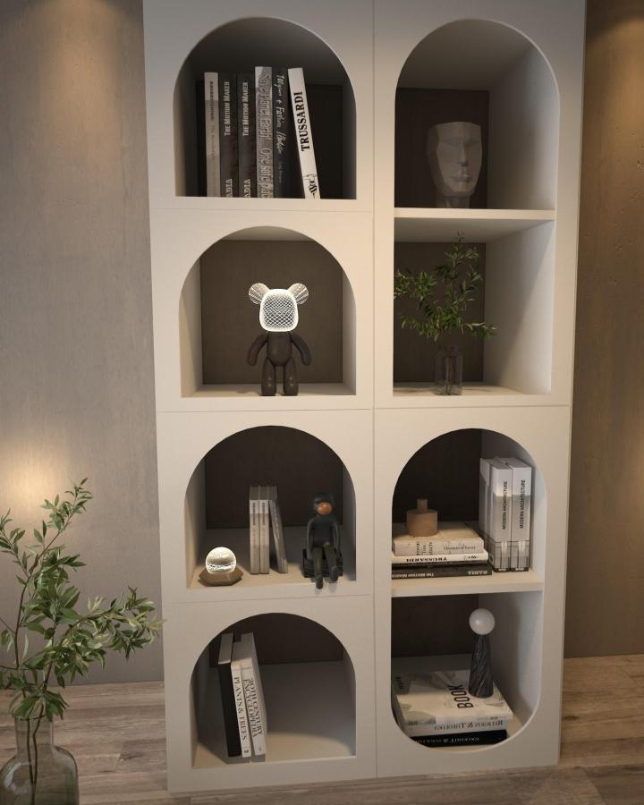 White modern shelving unit with arched cutouts by @guippdecor displaying books and decorative objects with contrast backing and soft curves. Contemporary stylish room storage.