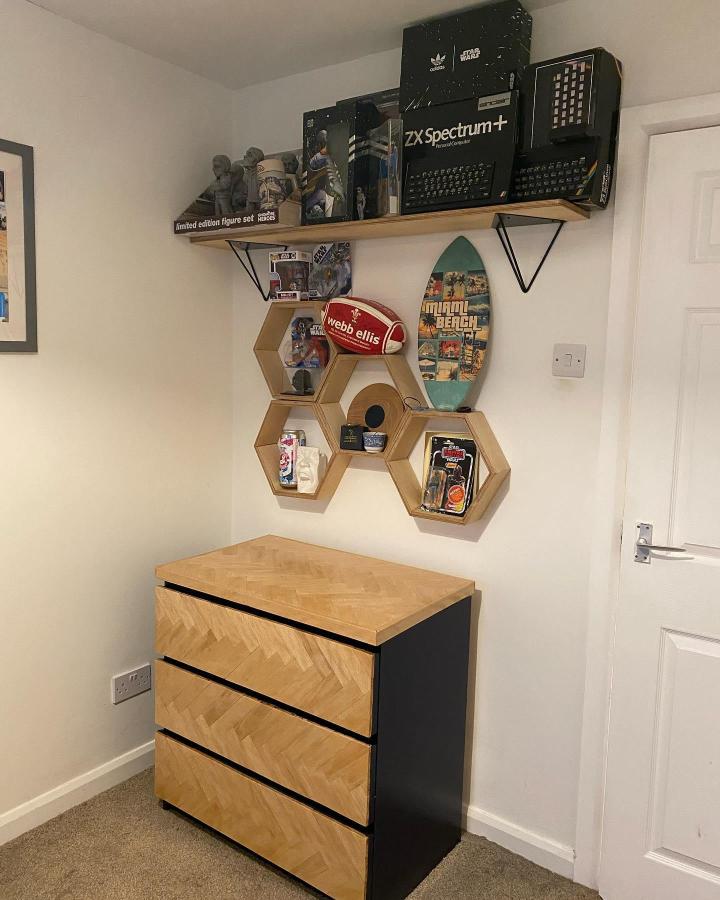 Natural wood and black painted dresser in a cozy room by @handcraftedbyaled with stylish drawer fronts and textured pattern.
