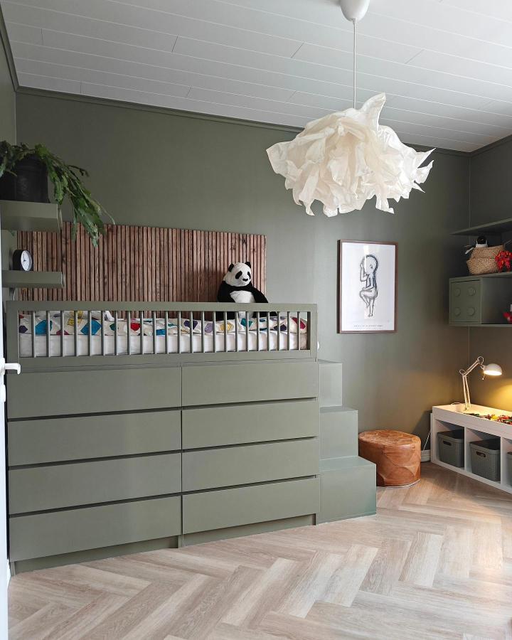 Olive green Ikea Malm dresser hack turned into a storage bed with stairs from @villa_akerladan in a kids room setting.