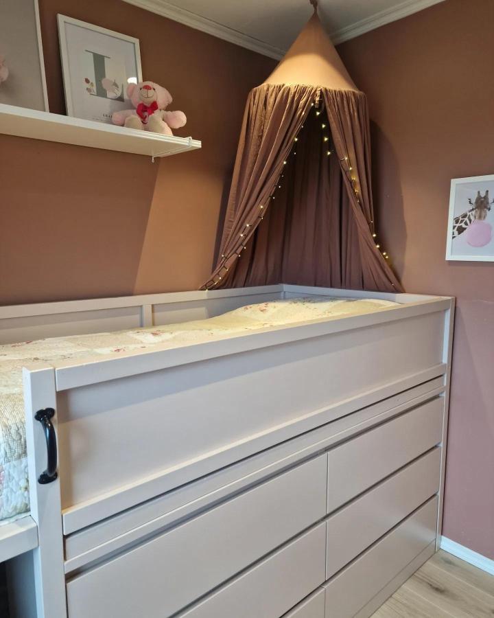 Light beige toddler bed with built-in drawers and fabric canopy by @fru.olsens Cozy combination of storage and sleeping space.
