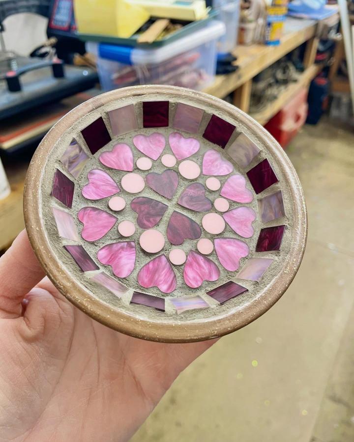 Pink and purple heart patterned mosaic trinket dish from @amberjoycreativefacilitator showcasing delicate mosaic tile craft ideas. Handmade glass tiles on small dish.