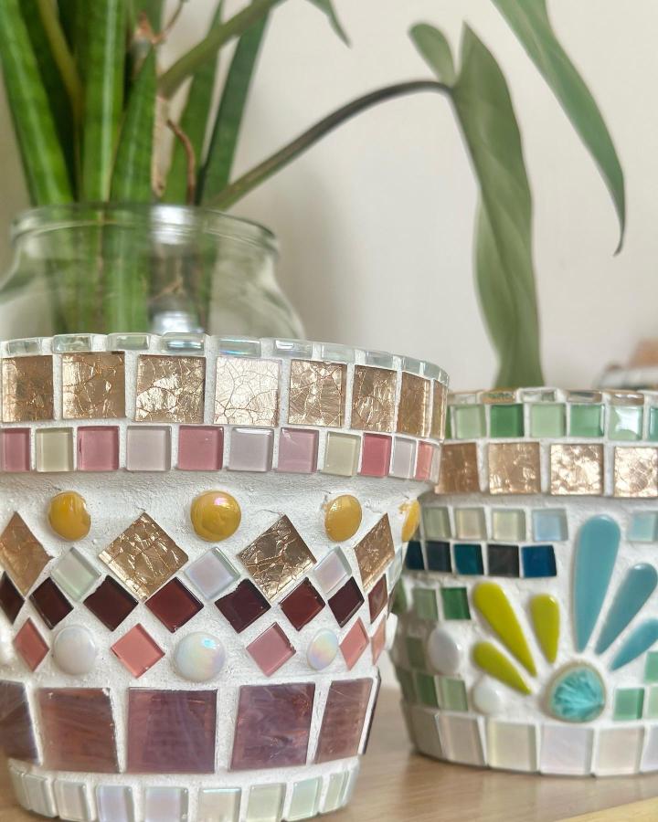 Gilded and pastel mosaic tile craft ideas on decorative planters from @wellness_art__nt showing jewel-tone accents and texture variations.