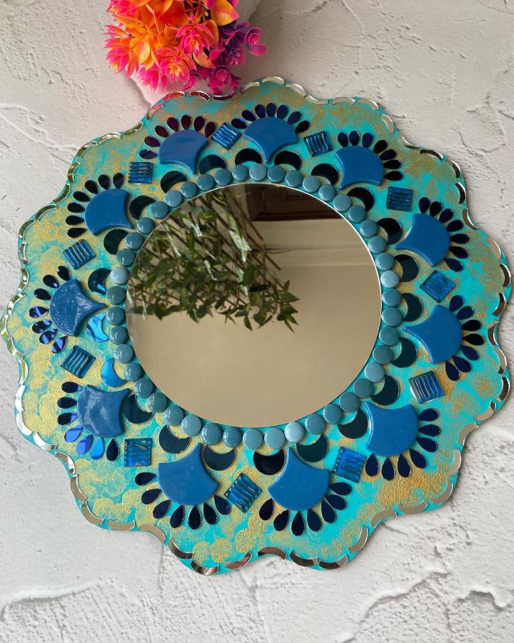 Blue and turquoise scalloped mirror frame mosaic tile craft ideas by @crystalindia featuring fan-shaped and round tiles with gold accents.