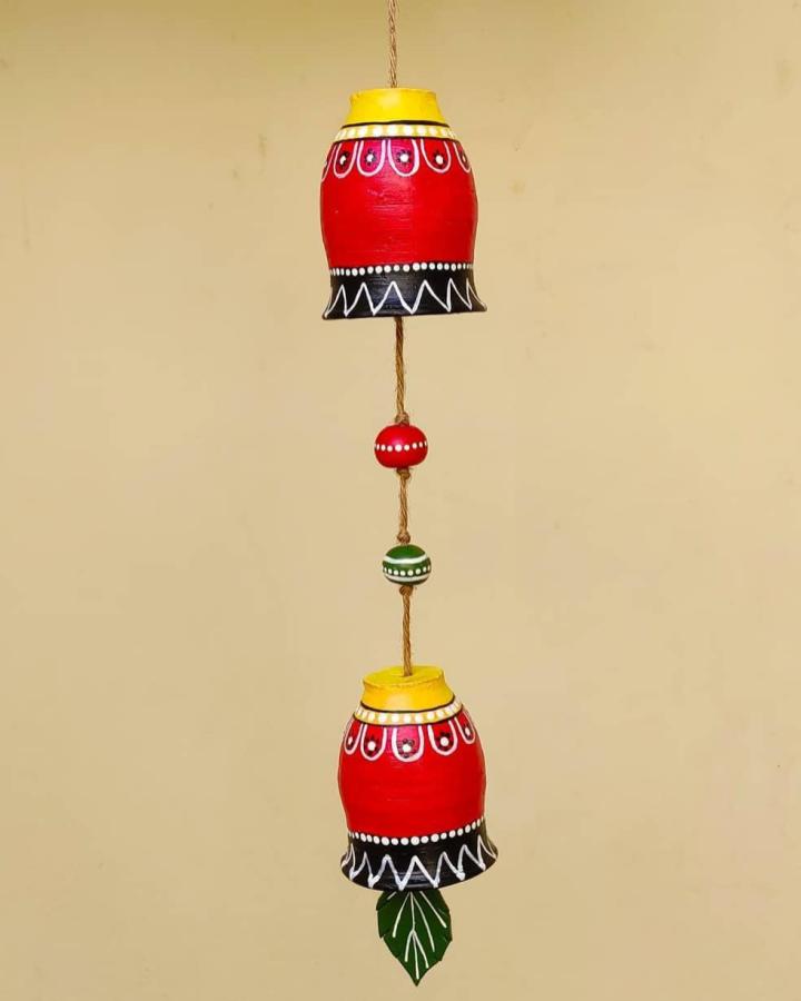 Brightly Painted Clay Pot Hanging Bells Decor with Jute and Leaf Detail by @craftclub007 showcasing folk art style and vibrant colors.