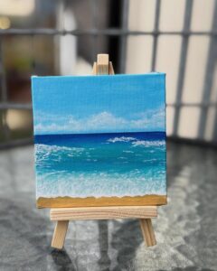 Mini ocean scene with layered blue waves and sandy shore on canvas by @brush_on. Small-scale coastal art with textured white highlights.