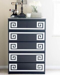 Black and white geometric overlay dresser in bedroom by @myoverlays with modern decorative panel update.