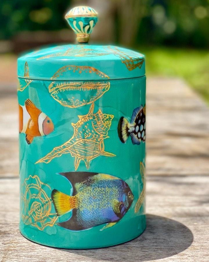 Turquoise fish decoupage canister from @ateliermichellemoyses. Colorful ocean motifs create beach crafts for adults.