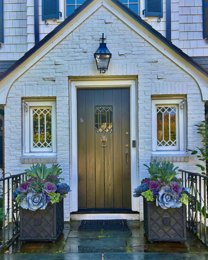 Blue-purple entry planters from @petalsbranches. Symmetrical fall planter ideas with cabbage and succulents.