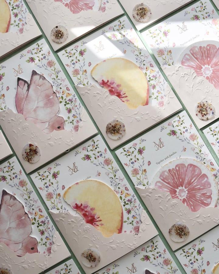 Cream floral handmade wedding invitations from @silentwordstudio. Embossed botanicals, watercolor petals, and dried-flower seals.