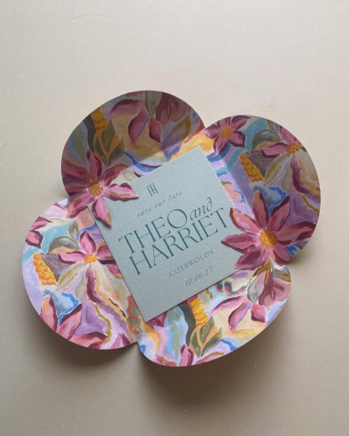 Multicolored floral flower-shaped handmade wedding invitations ideas from @harperandfinch_. Pale blue card with painted petals.