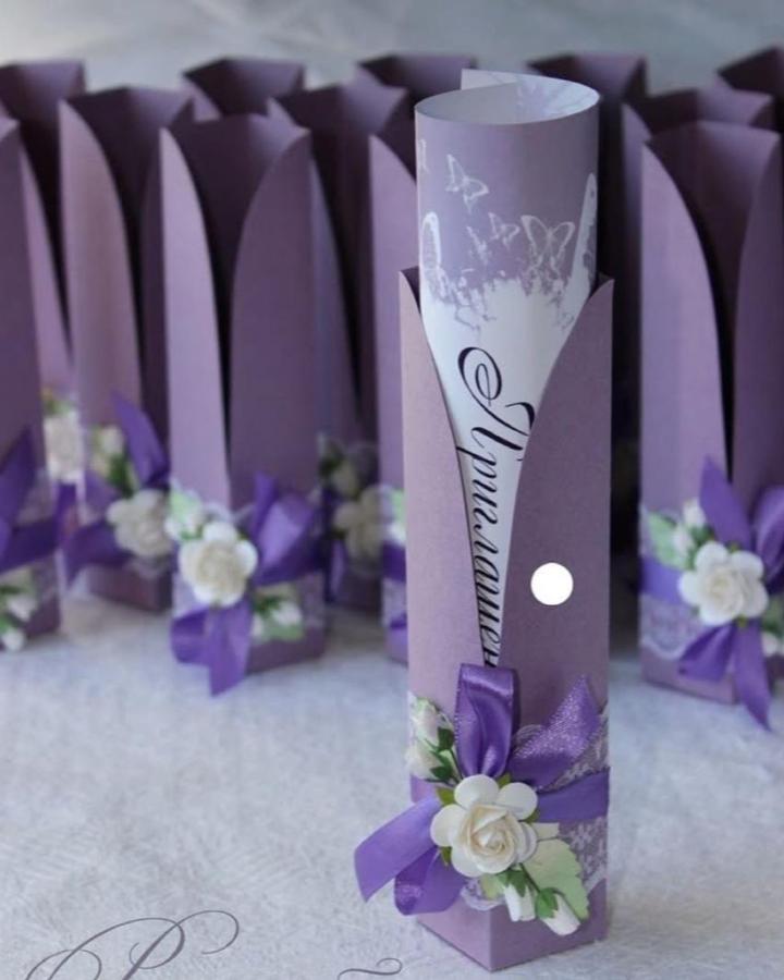 Lavender floral scroll sleeve invitations from @elitecardtz. Handmade wedding invitations ideas feature purple ribbons and white roses.