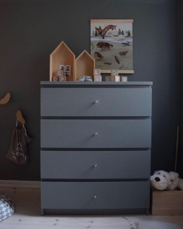 Charcoal gray dresser from @prettypegs. Painted dresser with new knobs for ikea malm hacks.