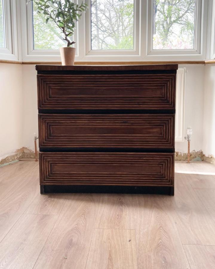 Dark walnut layered trim dresser from @my_homeandfamily. A striking example of ikea malm hacks.