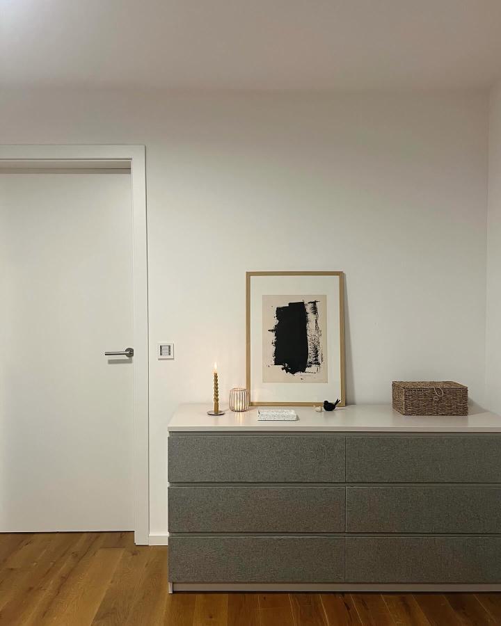 Soft gray textured-fabric dresser from @die_andi_. A refined Ikea Malm hack with a white top and warm wood flooring.