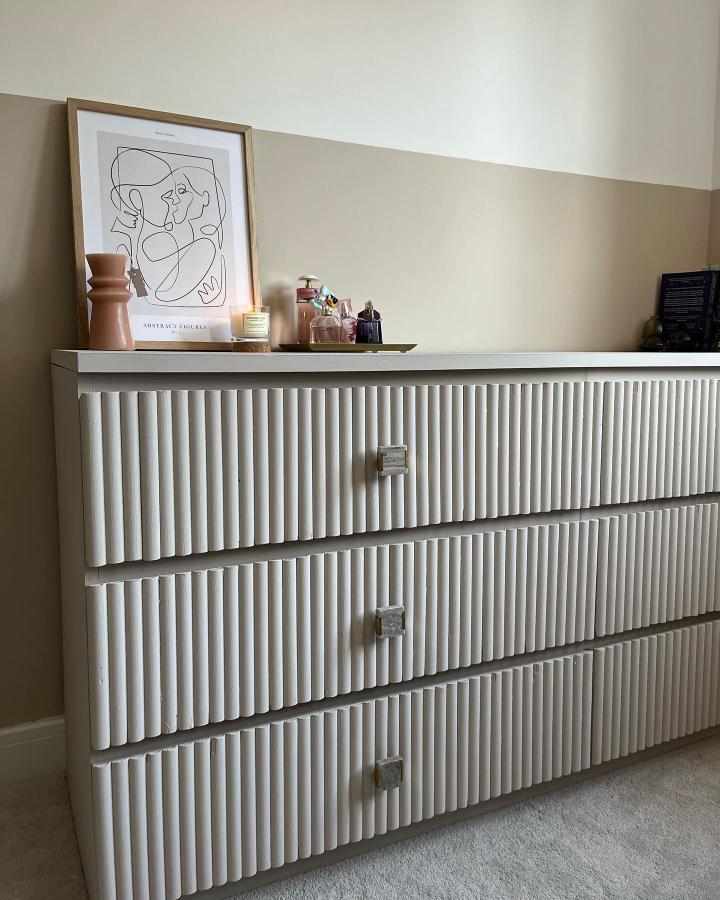 White fluted bedroom dresser from @jonesnewhome2024. Stylish ikea malm hacks with textured drawer fronts.