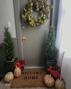 Olive Green Wreath And Woven Pumpkins From @decor_home_by_xiomy. Cozy narrow entryway harvest styling.