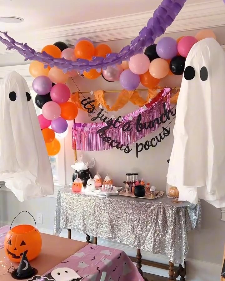 Ghosts, balloons, and colorful table decor create cheap halloween party ideas for a playful home celebration