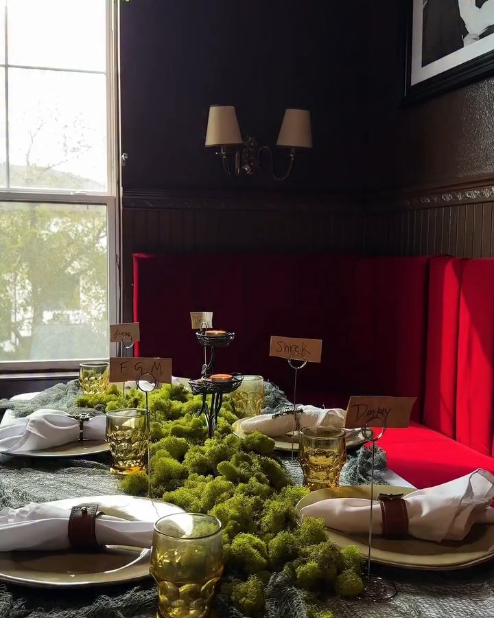 Mossy Shrek-themed Halloween table with thrifted glassware and handmade place cards