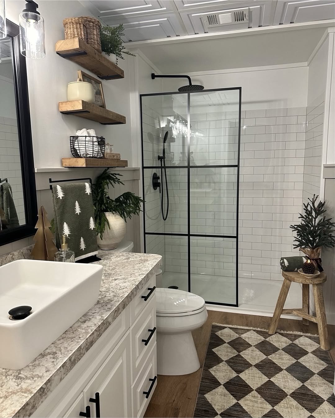 christmas bathroom decor ideas with rustic shelves, evergreen accents, and a festive tree towel