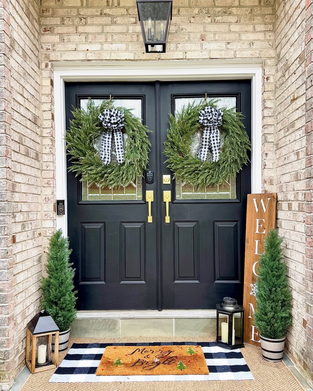 Christmas front door decor ideas with twin evergreen wreaths and buffalo check bows