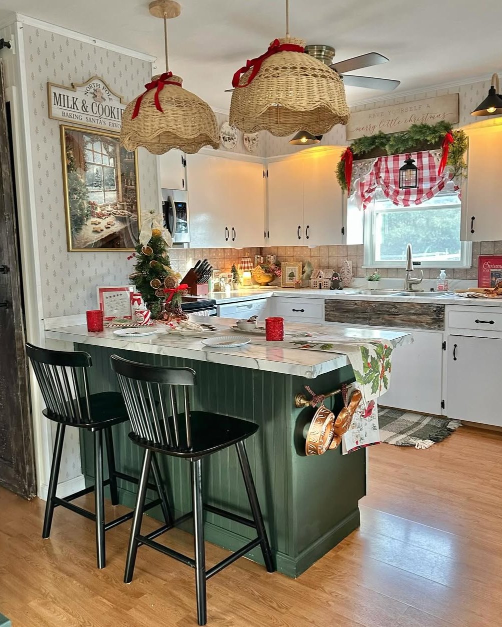 Wicker pendant lights and red-and-green accents in a cozy Christmas kitchen