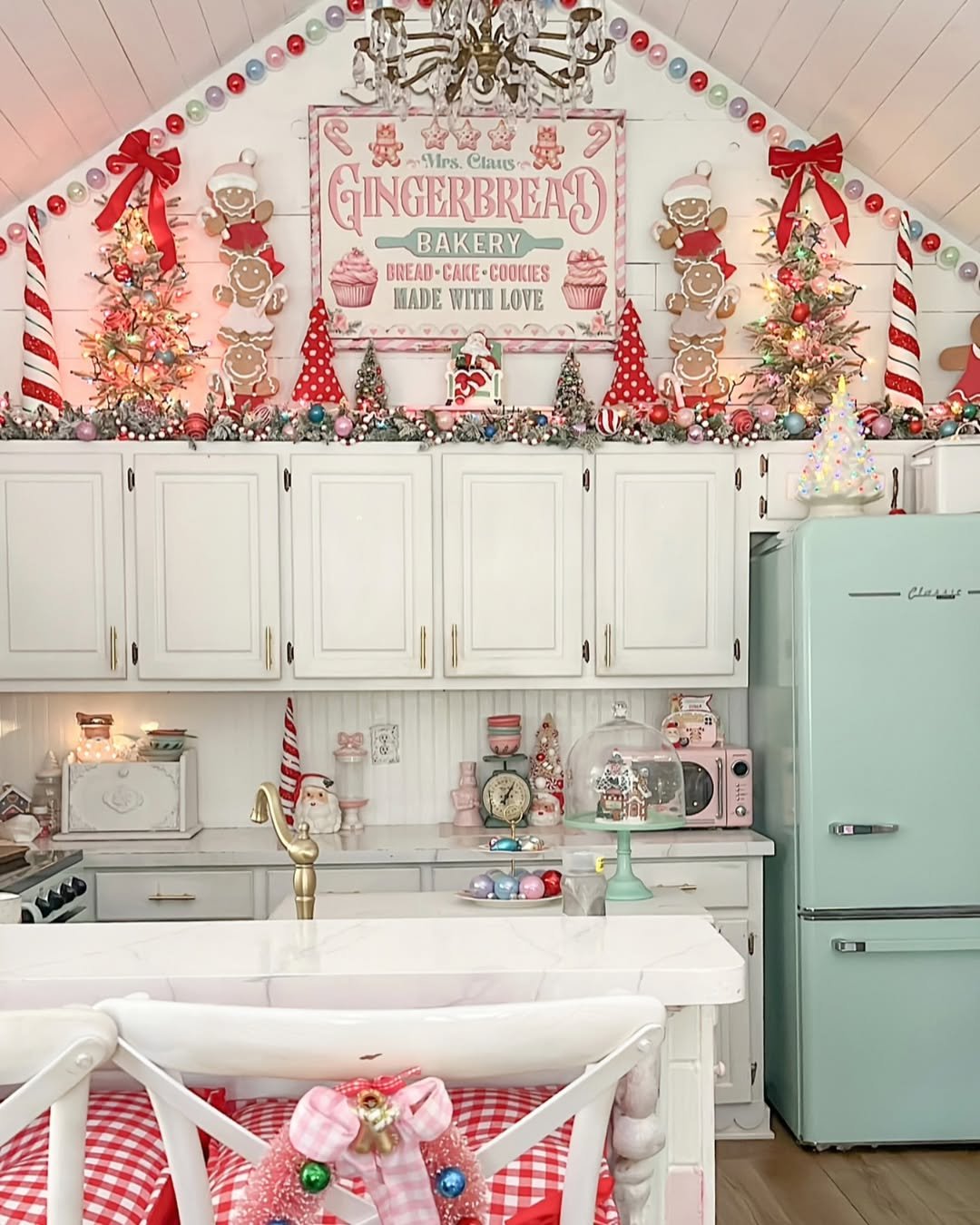 Pastel gingerbread bakery kitchen with candy ornaments and festive garlands