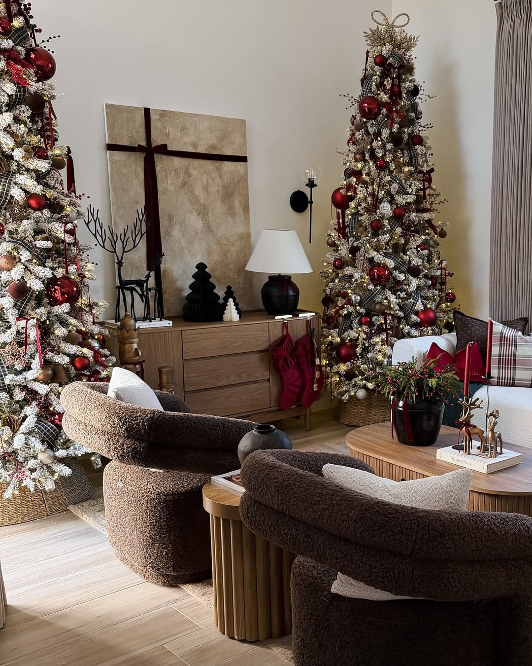 christmas living room decor ideas with layered burgundy trees and cozy festive accents