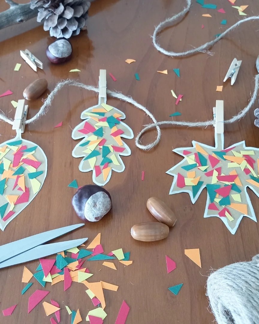 fall leaf crafts for kids featuring colorful mosaic paper leaves on twine