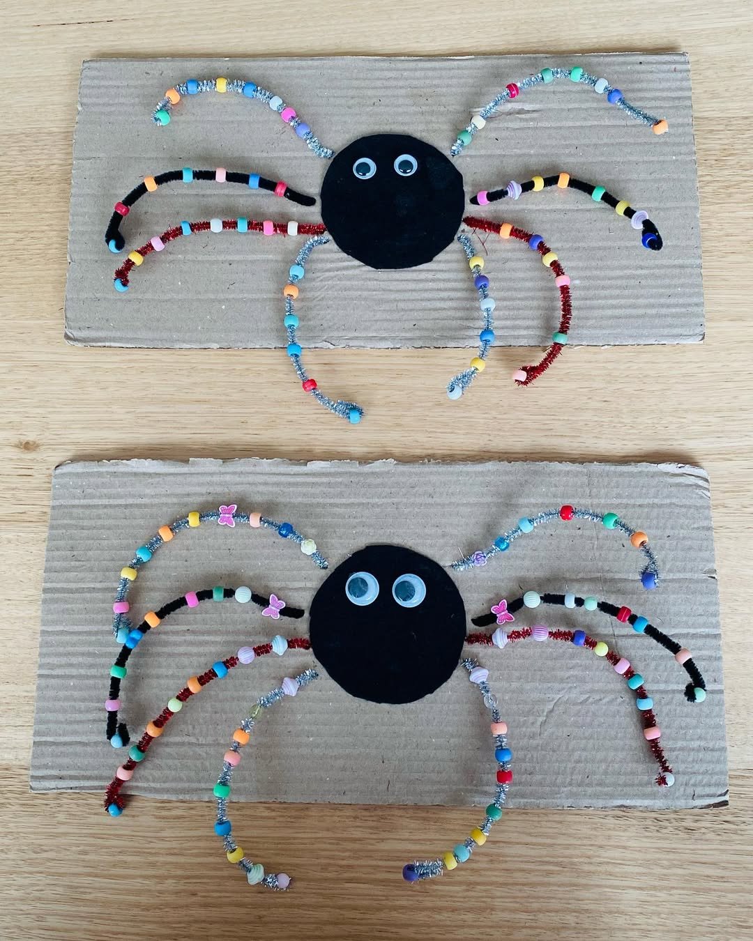 Colorful beaded spiders on cardboard for a playful children's Halloween craft
